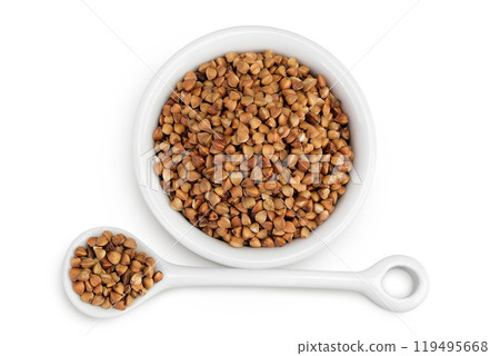 Raw buckwheat in ceramic bowl isolated on white background. Top view. Flat lay Raw buckwheat in ceramic bowl isolated on white background. Top view. Flat lay 119495668