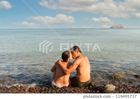 Couple in love kissing on the seashore Couple in love kissing on the seashore 119495737