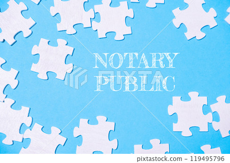 Puzzle with the word notary public written in white on a blue background Puzzle with the word notary public written in white on a blue background 119495796