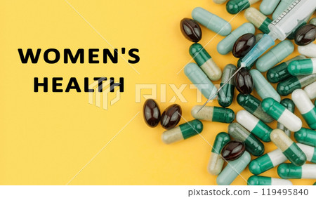 Bunch of pills with a syringe on top of them Bunch of pills with a syringe on top of them 119495840