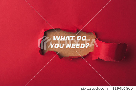 A red paper with a hole in it and the words What do you need written on it A red paper with a hole in it and the words What do you need written on it 119495860