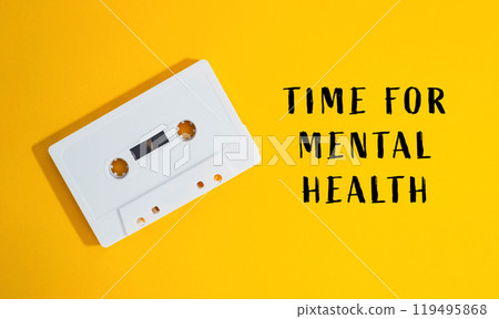 White cassette tape is on a yellow background White cassette tape is on a yellow background 119495868