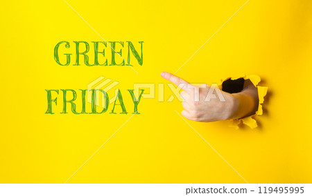 Hand pointing to the word Green Friday on a yellow background 119495995