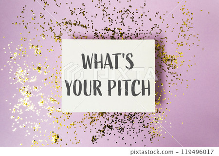 A white sign with gold glitter on it that says What's your pitch. 119496017