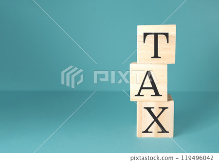 A stack of wooden blocks with the word tax on top A stack of wooden blocks with the word tax on top 119496042
