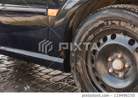 A Close-Up of a Black Car Tire and Wet Wheel Arch After a Wash A Close-Up of a Black Car Tire and Wet Wheel Arch After a Wash 119496150