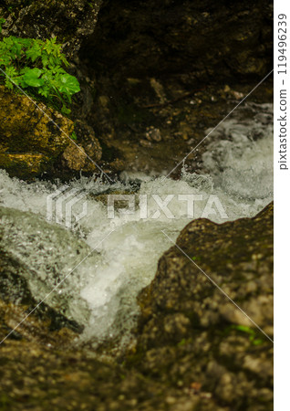Rushing water over rocks closeup. High quality photo 119496239