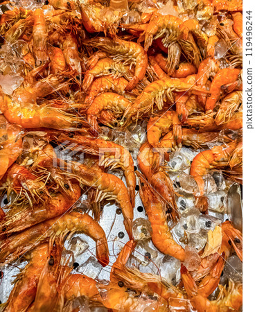 Fresh shrimp on ice at seafood restaurant buffet. High quality photo 119496244