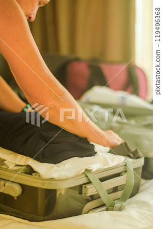 Suitcase, senior woman packing the clothes, bag and luggage for travel. High quality photo 119496368