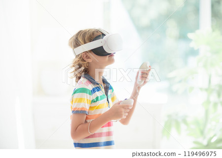 Child in virtual reality goggles. VR set for kids. Child in virtual reality goggles. VR set for kids. 119496975