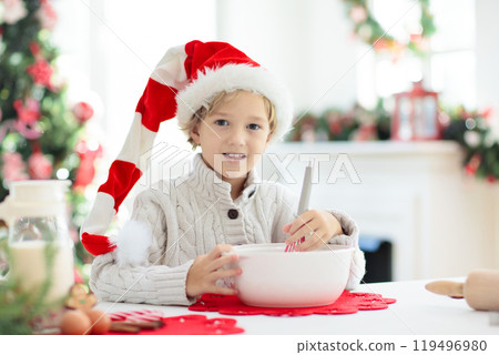 Family baking Christmas cookies. Kids Xmas fun. 119496980
