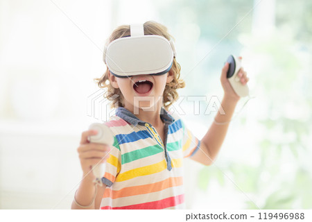 Child in virtual reality goggles. VR set for kids. 119496988