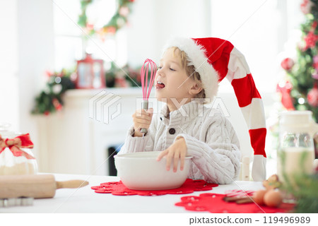 Family baking Christmas cookies. Kids Xmas fun. 119496989