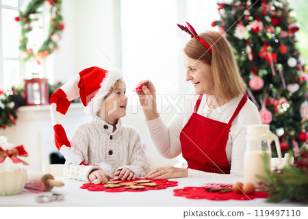 Family baking Christmas cookies. Kids Xmas fun. 119497110