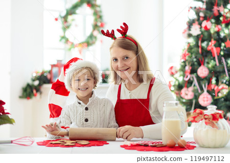 Family baking Christmas cookies. Kids Xmas fun. 119497112