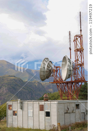 Telecommunications satellite dish radio telescope in mountains. Earth based astronomical locator 119497219
