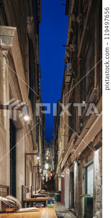A narrow street of the old town in Dubrovnik at night, Croatia. A narrow street of the old town in Dubrovnik at night, Croatia. 119497656