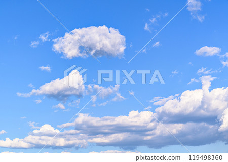 White clouds in a bright blue sky. The beauty of the nature	 119498360