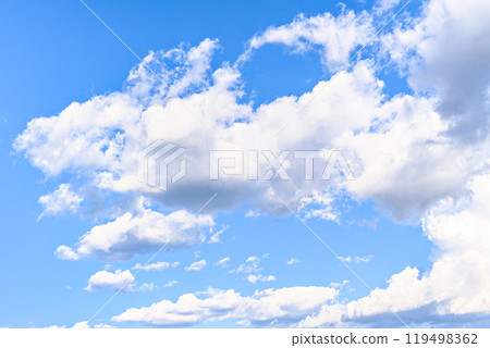 White clouds in a bright blue sky. The beauty of the nature White clouds in a bright blue sky. The beauty of the nature 119498362