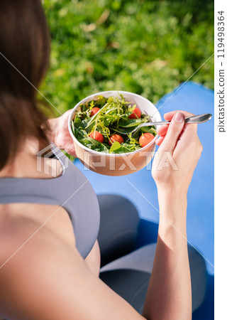 Female enjoying fitness in park eating vitamin-rich meal for health wellbeing in her pregnant life Female enjoying fitness in park eating vitamin-rich meal for health wellbeing in her pregnant life 119498364