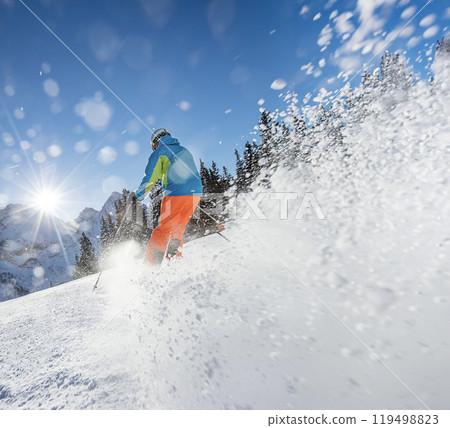 Freeride in fresh powder snow during sunny day. Freeride in fresh powder snow during sunny day. 119498823