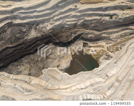 Deep opencast coal mine with many spiral roads. Aerial view Deep opencast coal mine with many spiral roads. Aerial view 119499585
