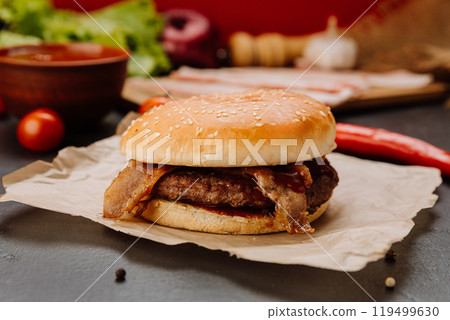 Juicy bacon burger with fresh ingredients, perfect for fast food lovers and gourmet enthusiasts 119499630