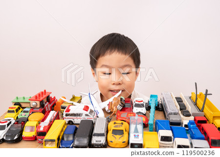 A boy playing with a toy A boy playing with a toy 119500236