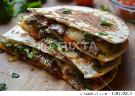 Stack of delicious quesadillas with melted cheese is waiting to be eaten Stack of delicious quesadillas with melted cheese is waiting to be eaten 119500260