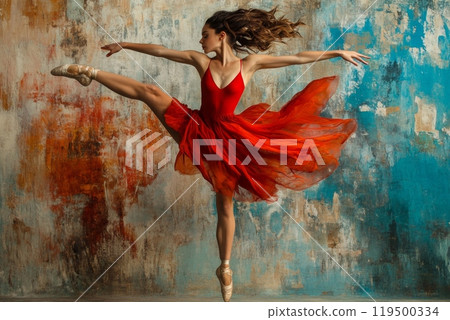 Graceful ballerina wearing red dress performing jump in studio 119500334