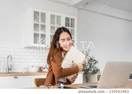 Young asian woman using computer laptop at home 119501463