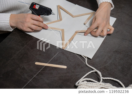Ice cream sticks Christmas star Sustainable preparation Diy process making handmade decoration. Step by step activity for children. Inclusive and responsible stress relief holiday hobby 119502236