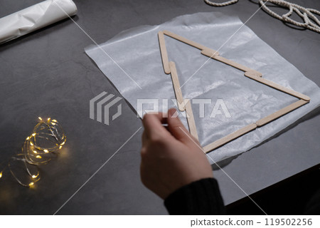 Ice cream sticks Christmas tree Sustainable preparation Diy process making handmade decoration. Step by step activity for children. Inclusive and responsible stress relief holiday hobby 119502256