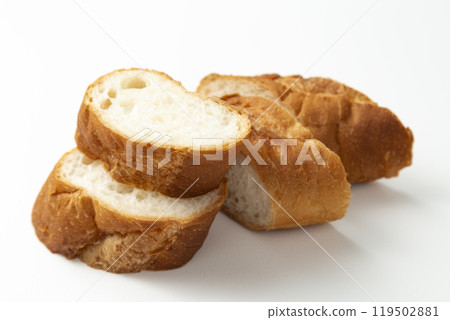Cut baguette on a white background 119502881