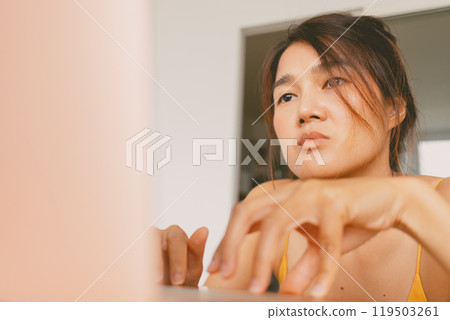 woman working with her laptop computer boring work from home. 119503261