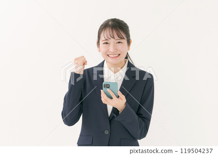 A woman in a suit that makes a guts pose 119504237