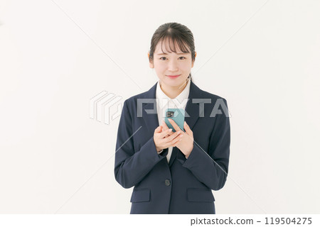 A woman with a suit with a smartphone 119504275