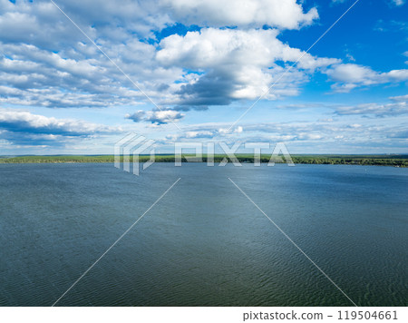 Aerial view of lake or river green shore with forest. Summer season. 119504661