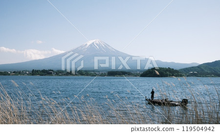 fishing in kawaguchiko, with the background of mt. fuji 119504942