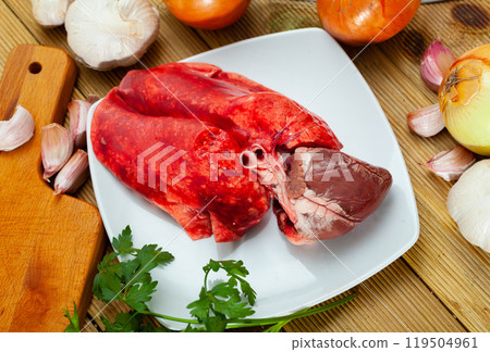 Raw lamb lungs and heart served with greens, nobody Raw lamb lungs and heart served with greens, nobody 119504961