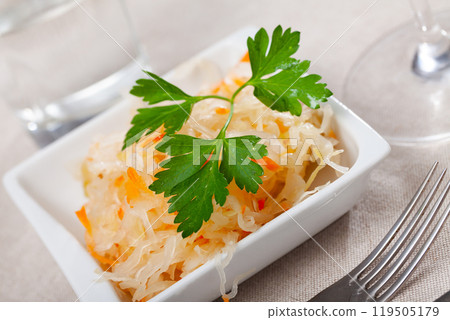 Homemade sauerkraut on white plate Homemade sauerkraut on white plate 119505179