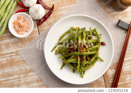 Stir fried french green been with chili and salt in white plate.Top view. 119505258
