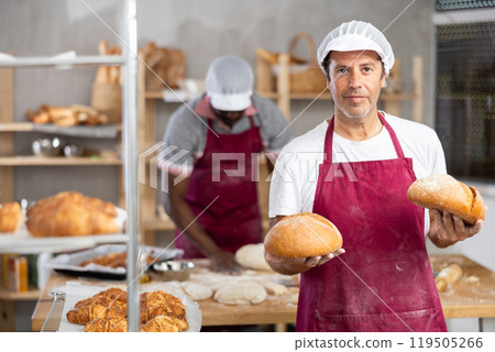 Adult man baker with homemade bread 119505266