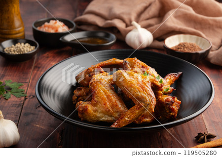 Air Fryer Chicken whole wings (Chicken 3 Joint Wing) with salt in black plate.Crispy and Healthy cooking. 119505280