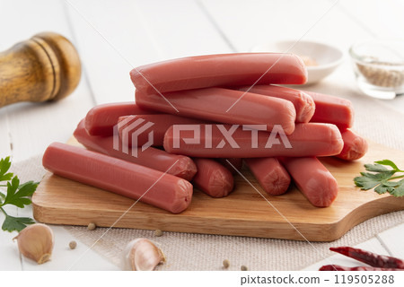 Chicken red sausage,Cocktail Sausage on wooden plate. 119505288
