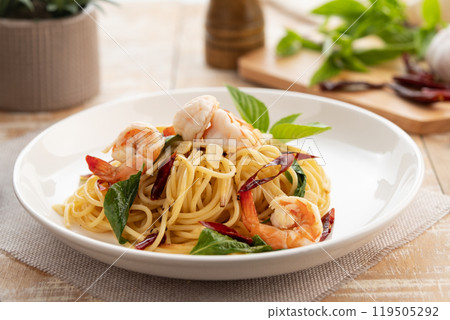 Stir Fried Spaghetti with Dried Chili and garlic with Shrimp in white plate. 119505292