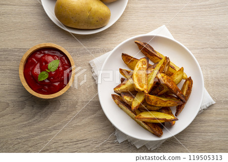 Air Fryer Roast Potatoes on white plate with potato sauce.Top view Air Fryer Roast Potatoes on white plate with potato sauce.Top view 119505313