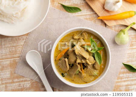 Green Curry with duck meat.Thai sliced duck breast with green curry paste and coconut milk in white bowl ,thai food ,Gaeng Kiew Wan.Top view. Green Curry with duck meat.Thai sliced duck breast with green curry paste and coconut milk in white bowl ,thai food ,Gaeng Kiew Wan.Top view. 119505315