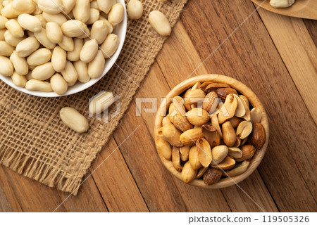 Close up Air fryer Roasted peeled peanuts in wooden bowl.rich in protein,fat,and fiber.Top view Close up Air fryer Roasted peeled peanuts in wooden bowl.rich in protein,fat,and fiber.Top view 119505326