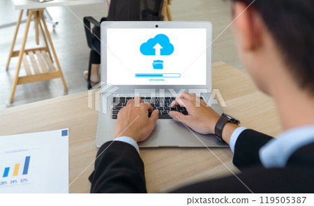 Data storage, networking and internet service concept. Back view of businessman using cloud drive technology upload save files to internet. 119505387